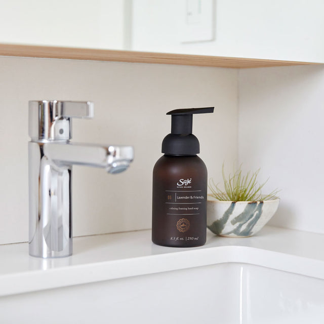 Lavender and friends calming foaming hand soap 8.5fl oz placed on the sink 